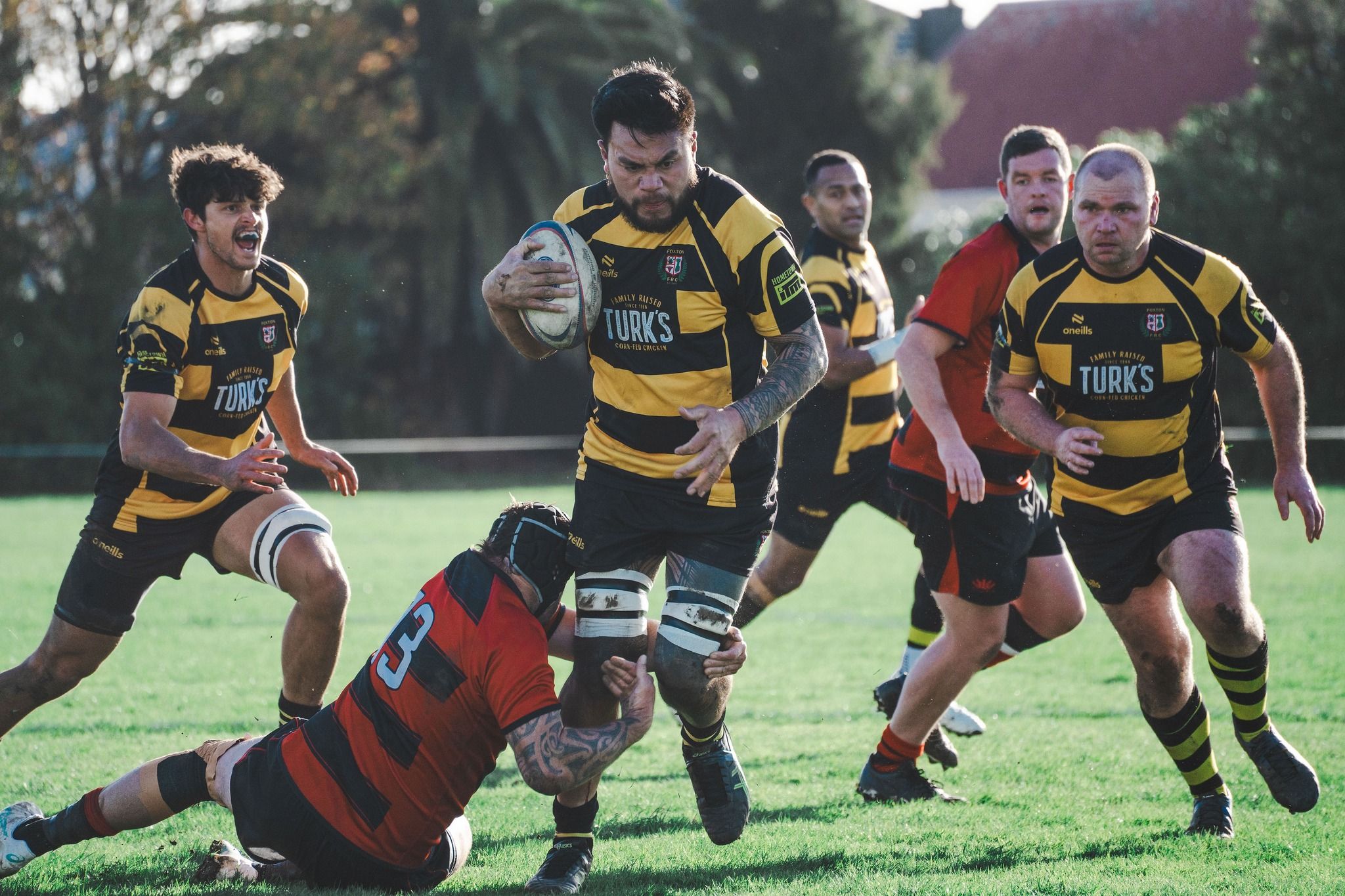 Men playing rugby