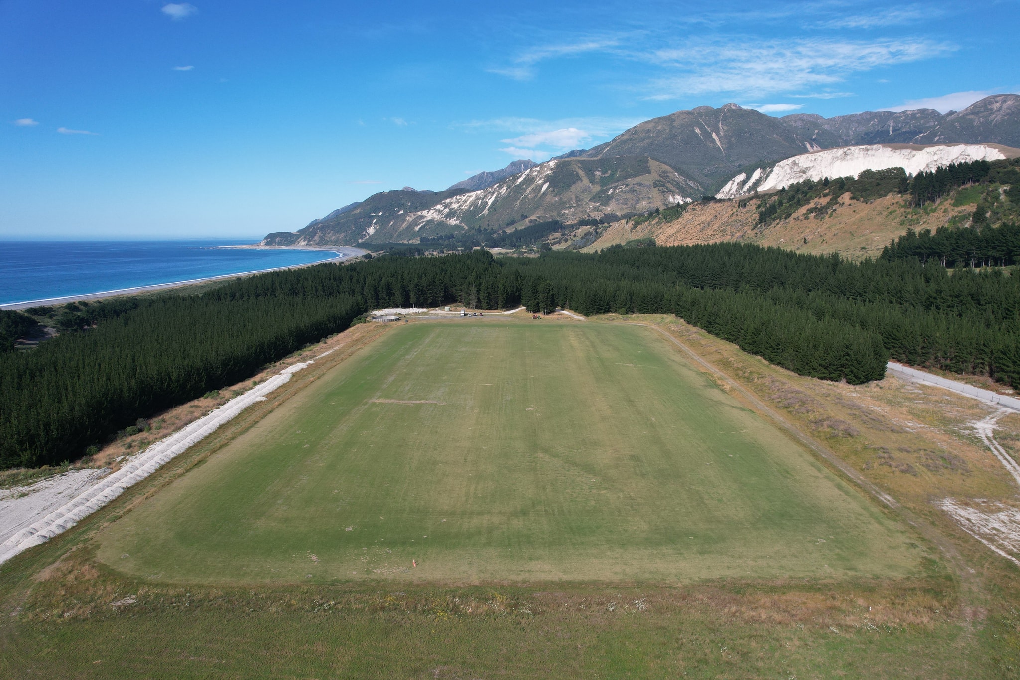 Overhead view of large field along the coastline