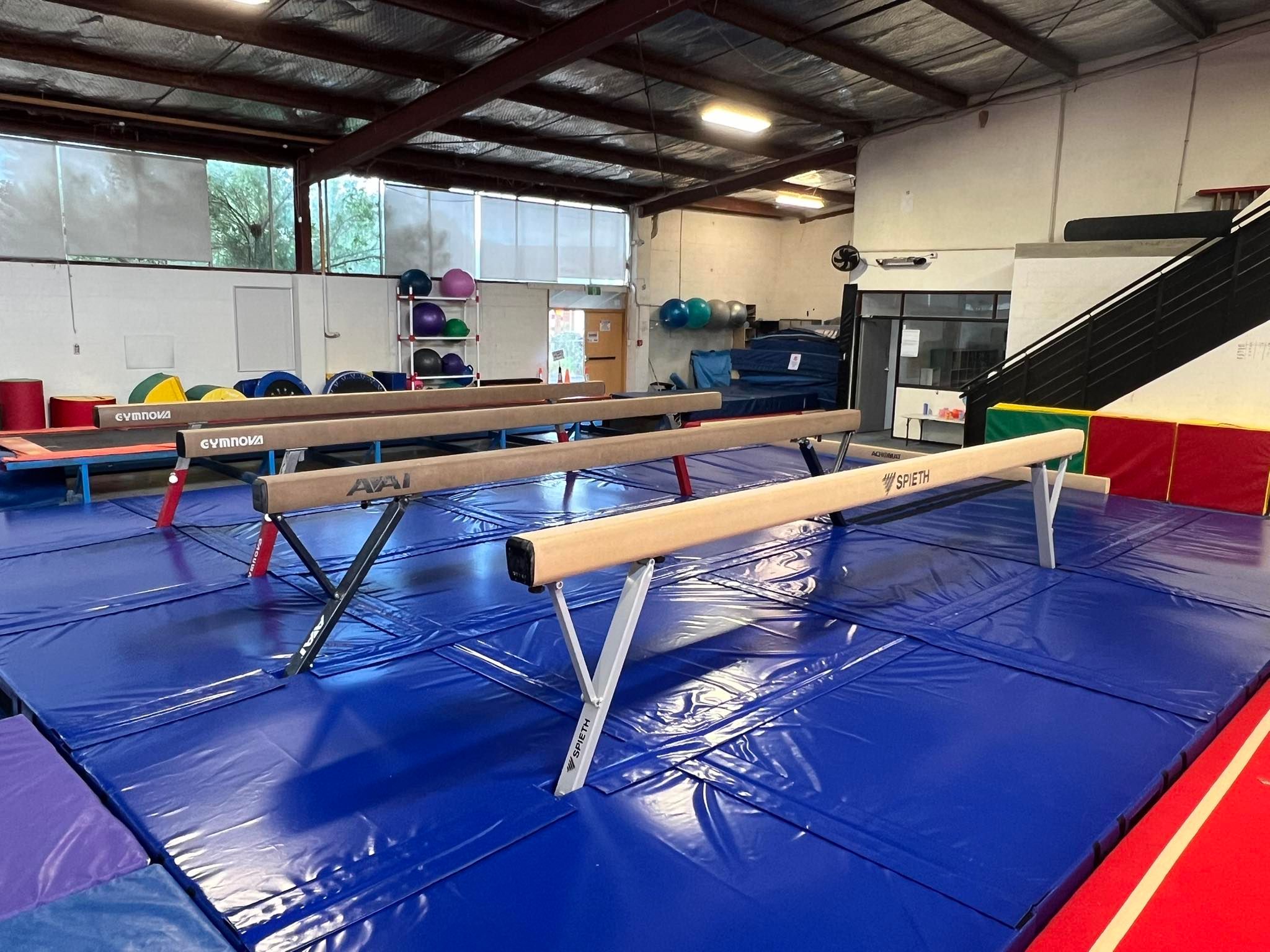Beams and mats in a gym