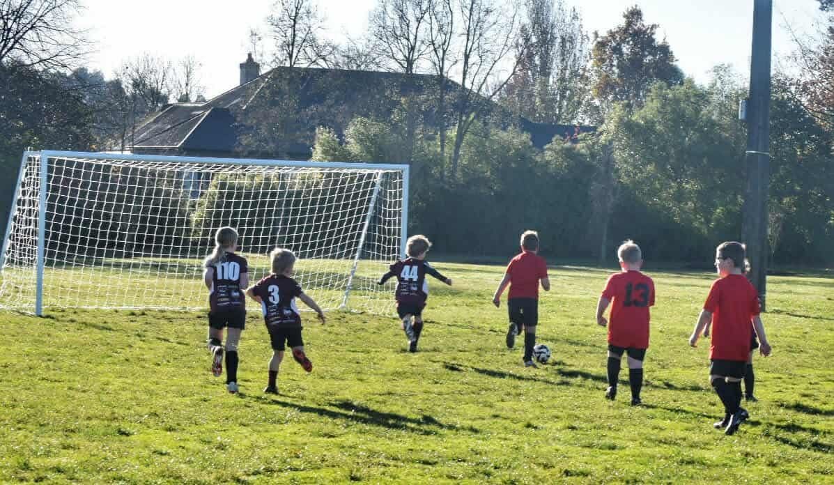 Juniors playing football